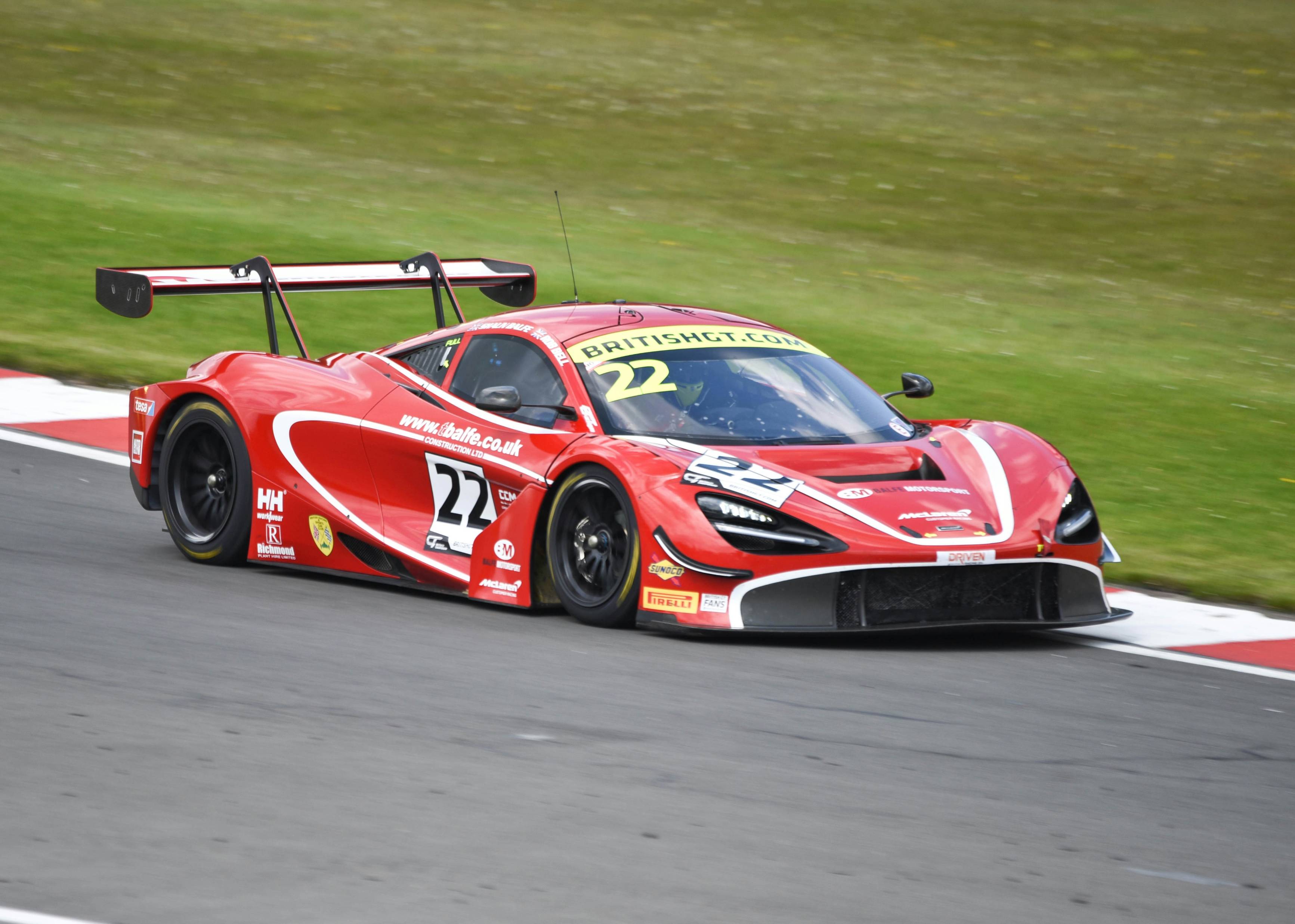 red and white ferrari f 1 on race track