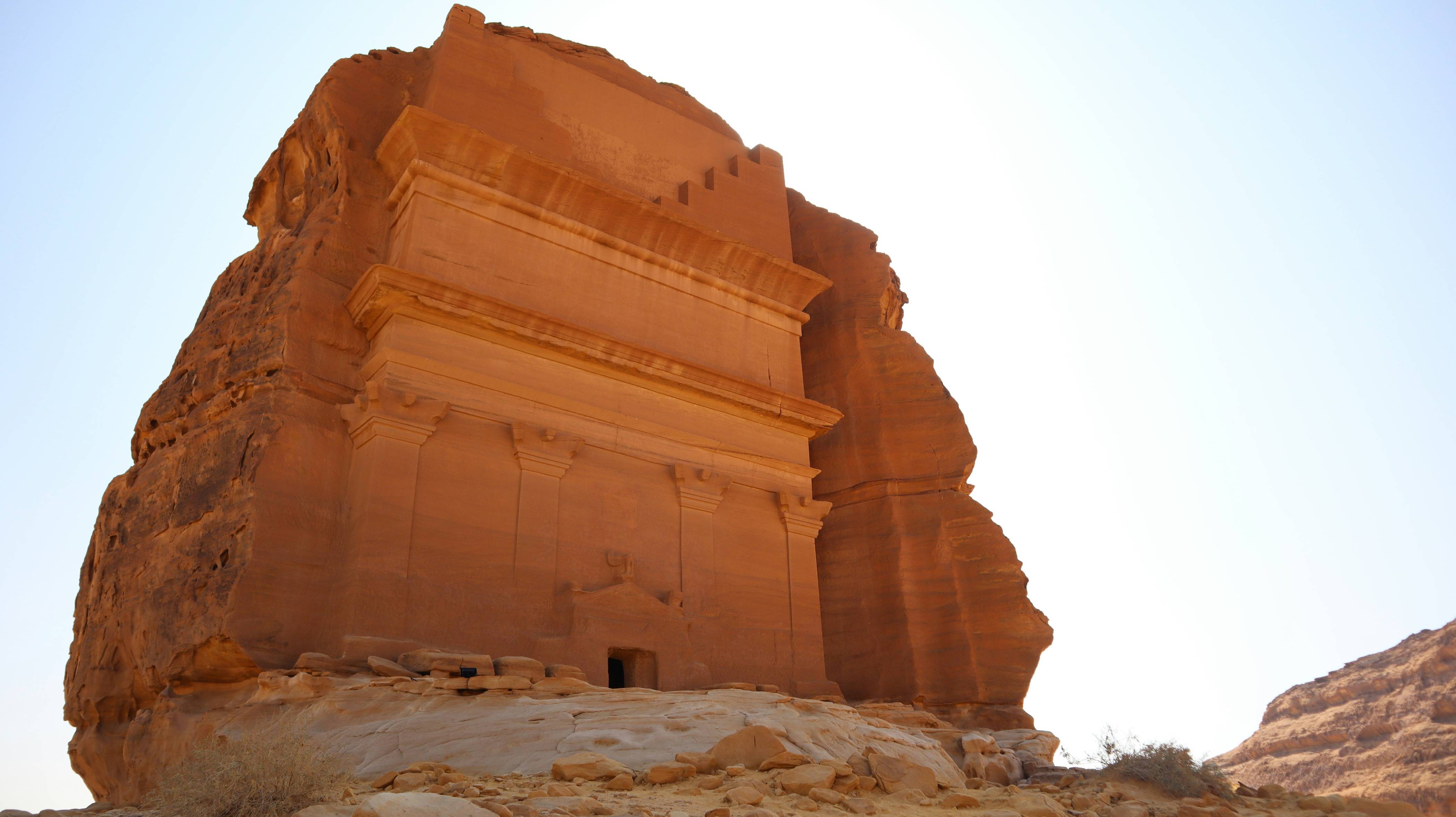 a large stone structure in the middle of a desert