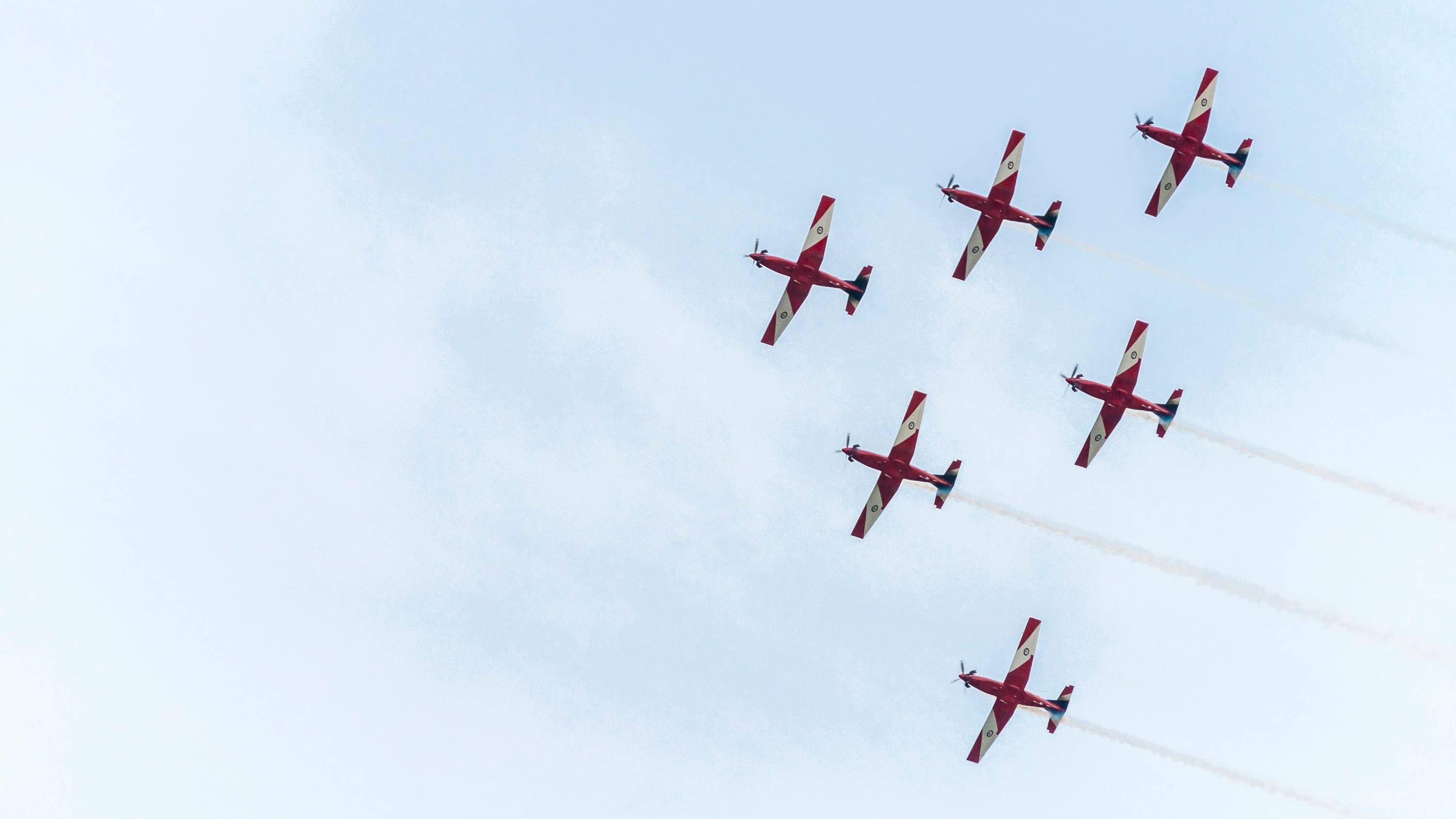six red planes under white sky during daytime